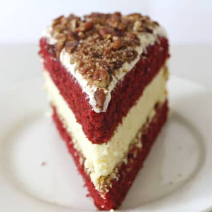 Slice of red velvet cake cheesecake.