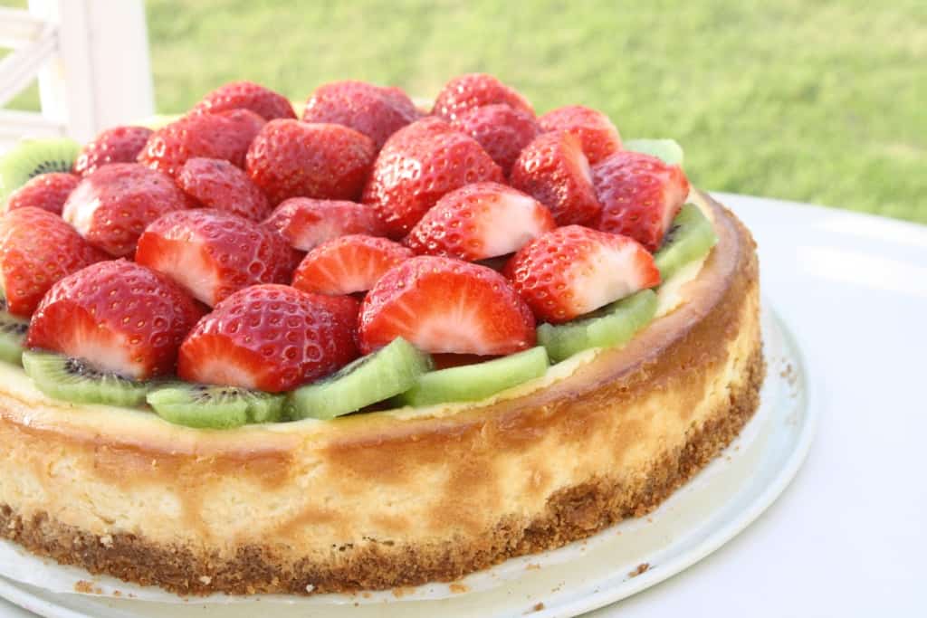 Strawberry Kiwi Cheesecake on a table.