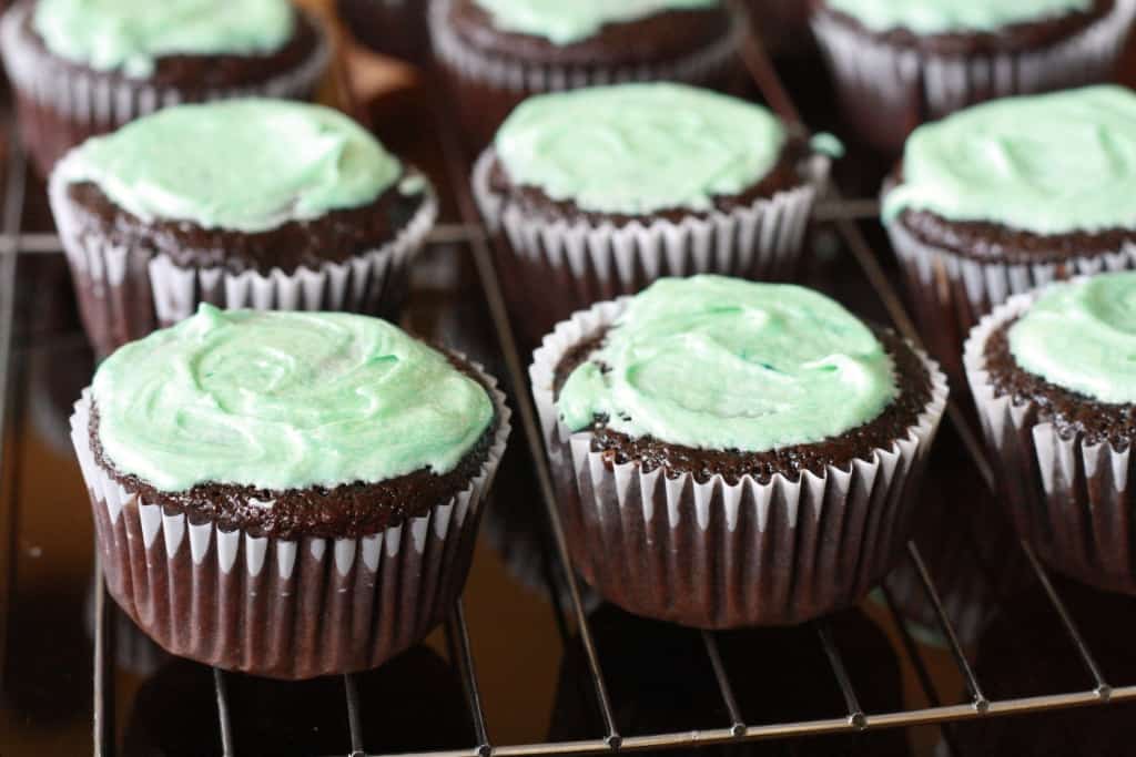 Cupcakes with green frosting on top.