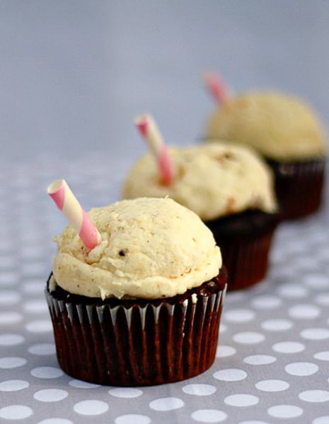 A row of root beer float cupcakes.