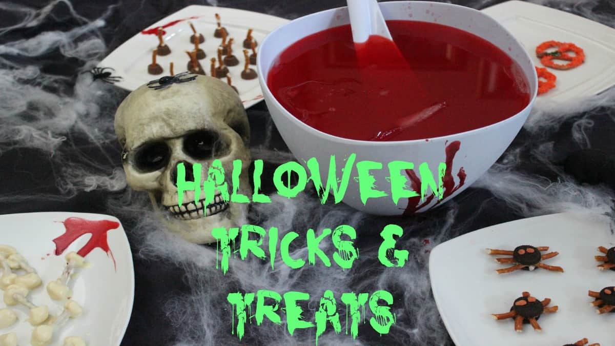 DIY Halloween Treats & Snacks on a black table.