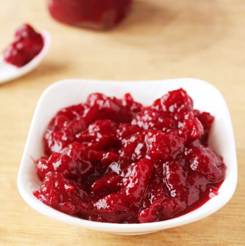Cranberry sauce in a white dish.