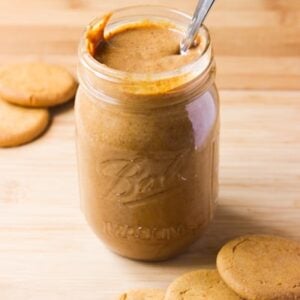 Side on shot of cookie butter in a glass jar.