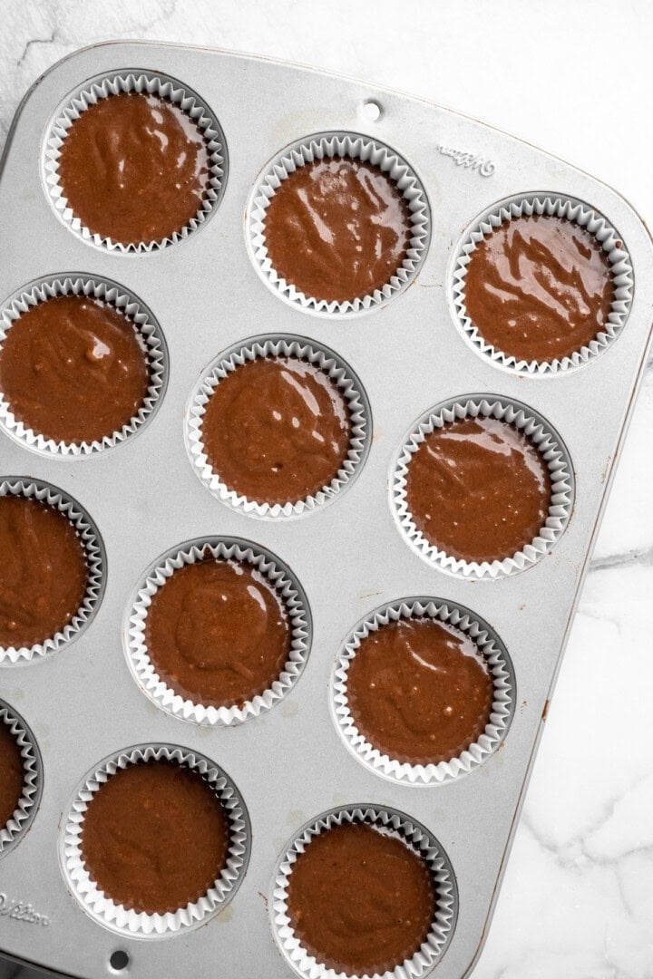 Chocolate cupcake batter in pan before baking.