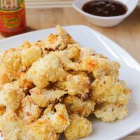 Cauliflower wings on a big white plate.