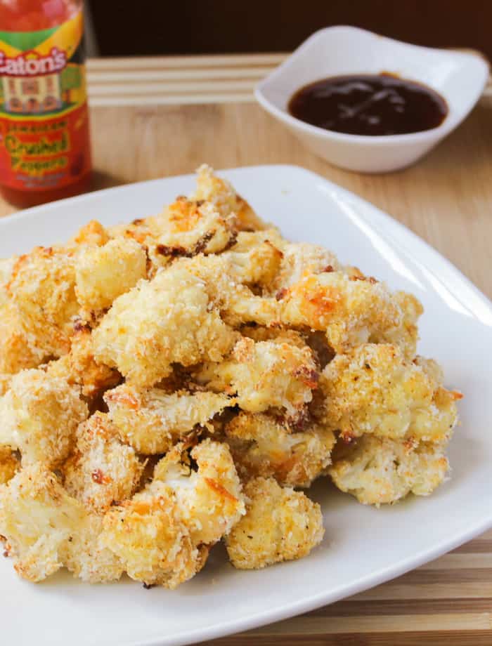 Cheesy buffalo cauliflower wings on a plate.