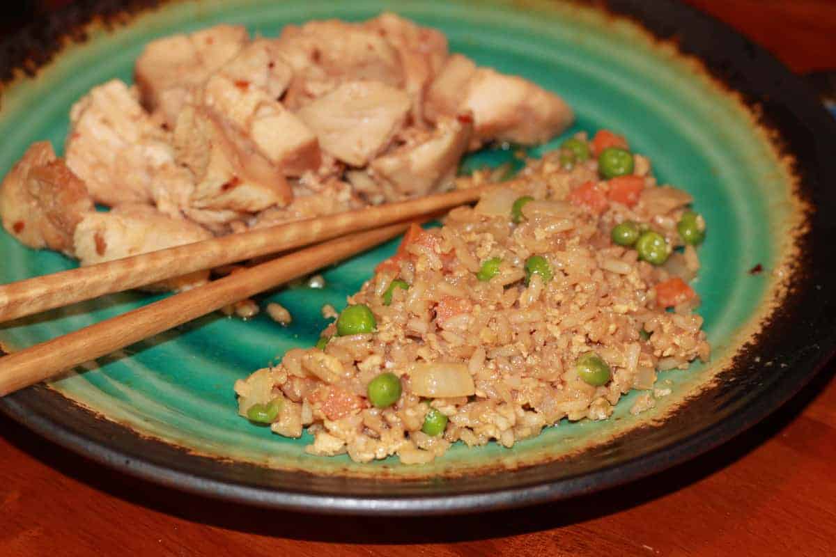 A green plate with Fried Rice.