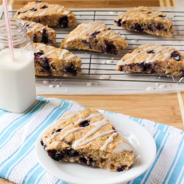 Lemon blueberry scones on a wire rack.