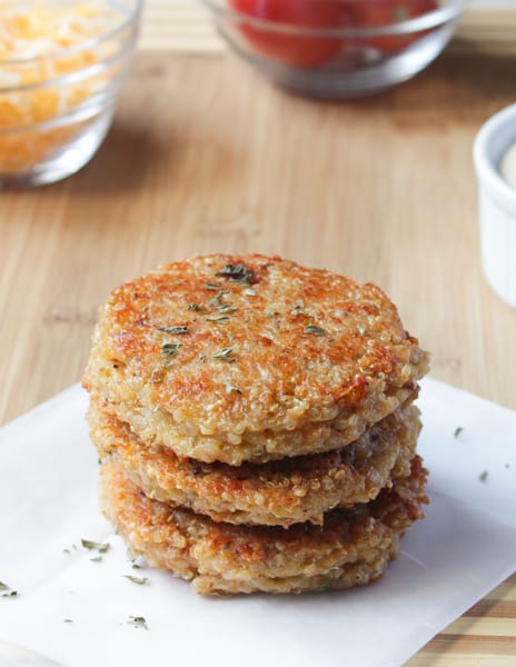 A stack of sundried tomato and mozzarella quinoa burgers.