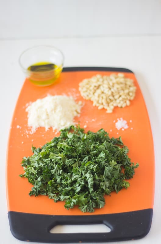 Ingredients for pest on a chopping board.