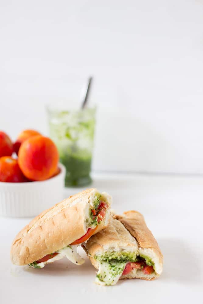 This Caprese Sandwich takes a twist by being toasted with melted mozzarella, and creamy parsley pesto. The sandwich is perfect for an everyday lunch or a picnic! | https://jessicainthekitchen.com