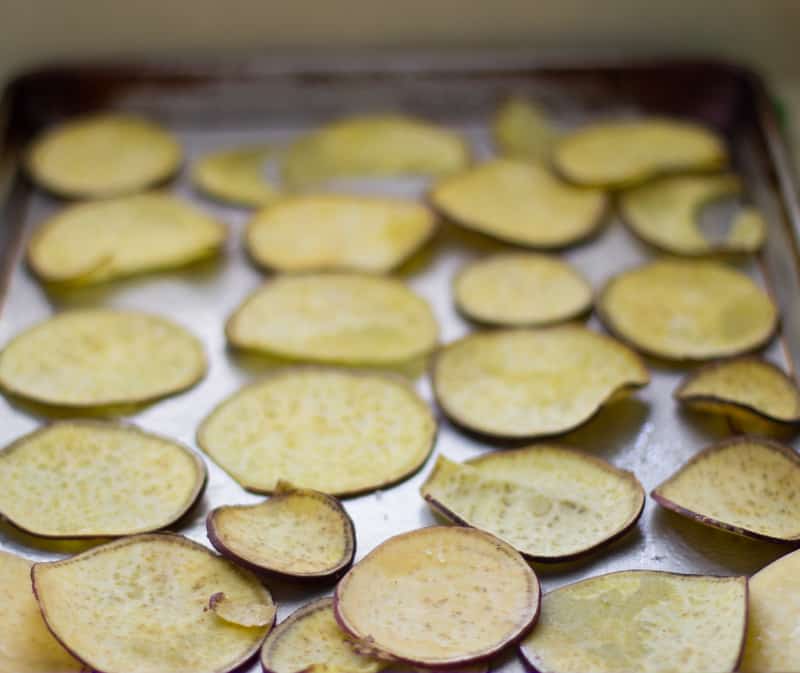 Sweet potato chips on a baking sheet.