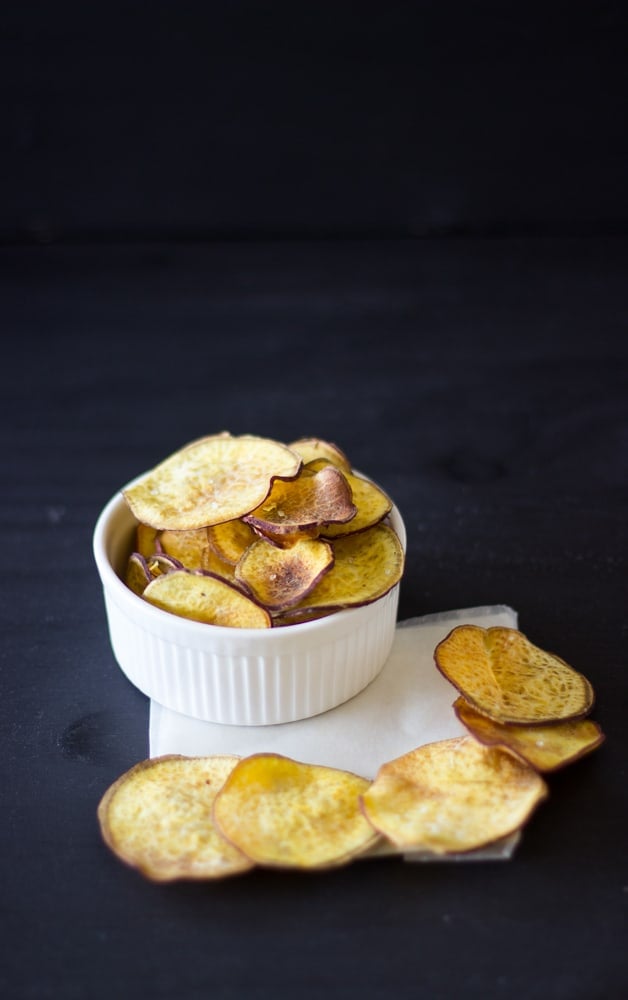 Sweet potato chips in a white ramekin. 