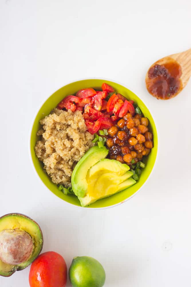 Top down view of a quinoa bowl, topped with avocado.