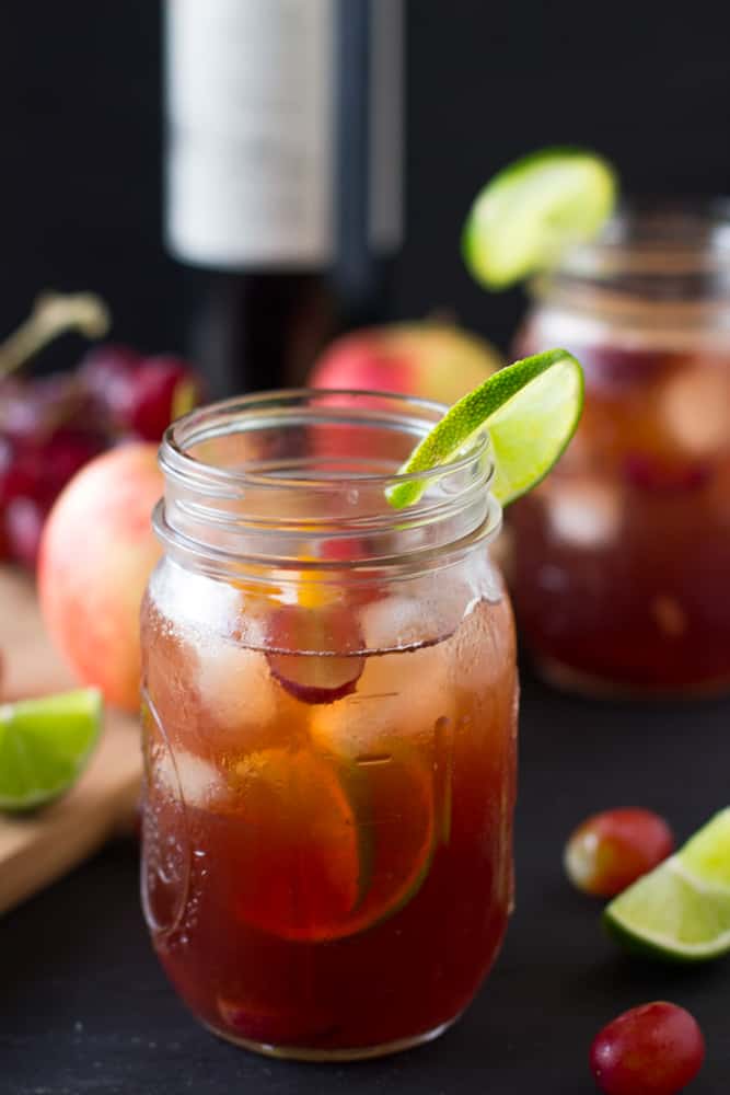 Close up of rose sangria in a mason jar.