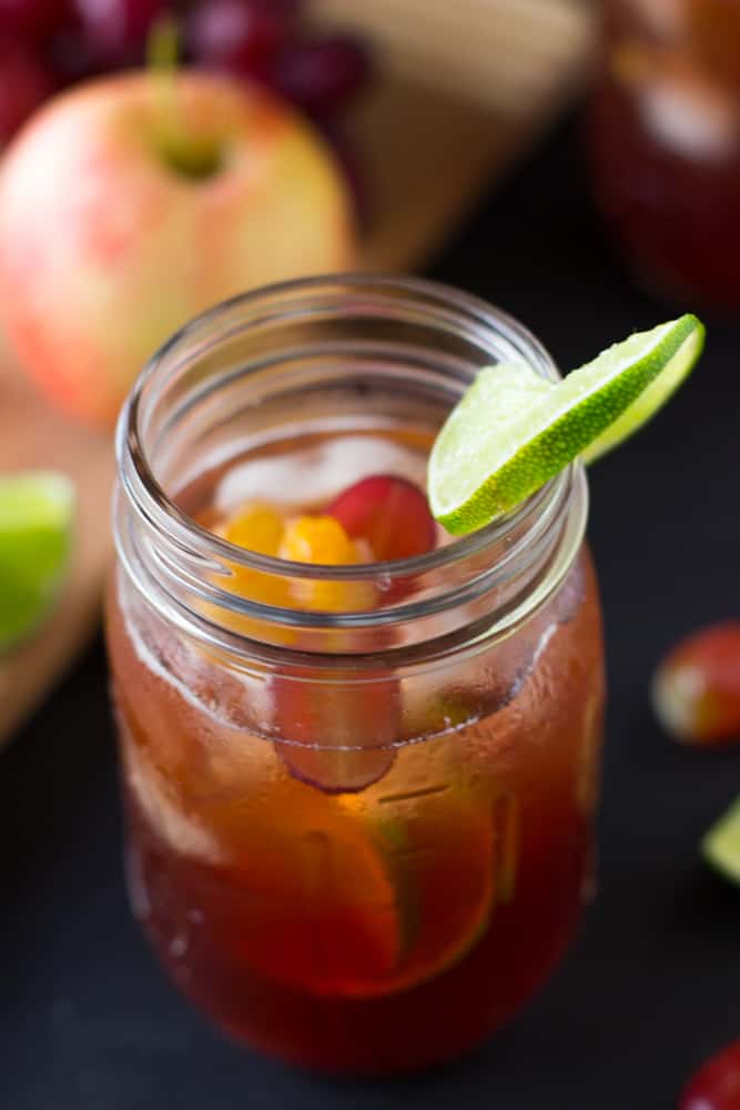 Top down shot of Rose Sangria in a mason jar with a slice of lime. 