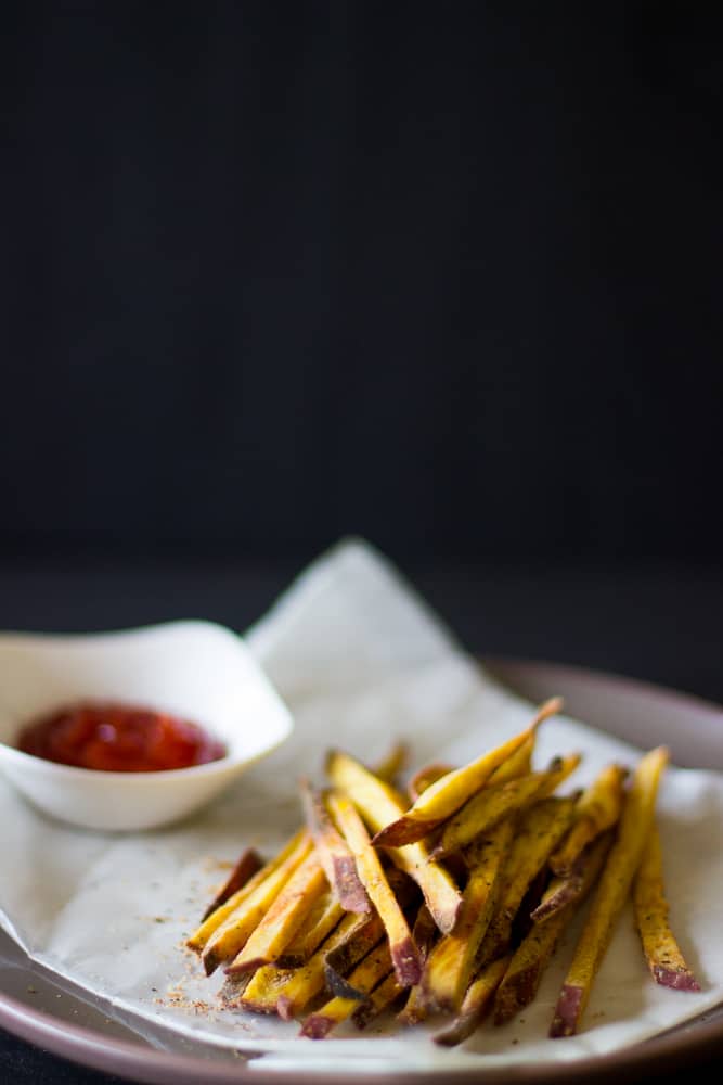 Sweet Potato Fries on a grey plate with dip.