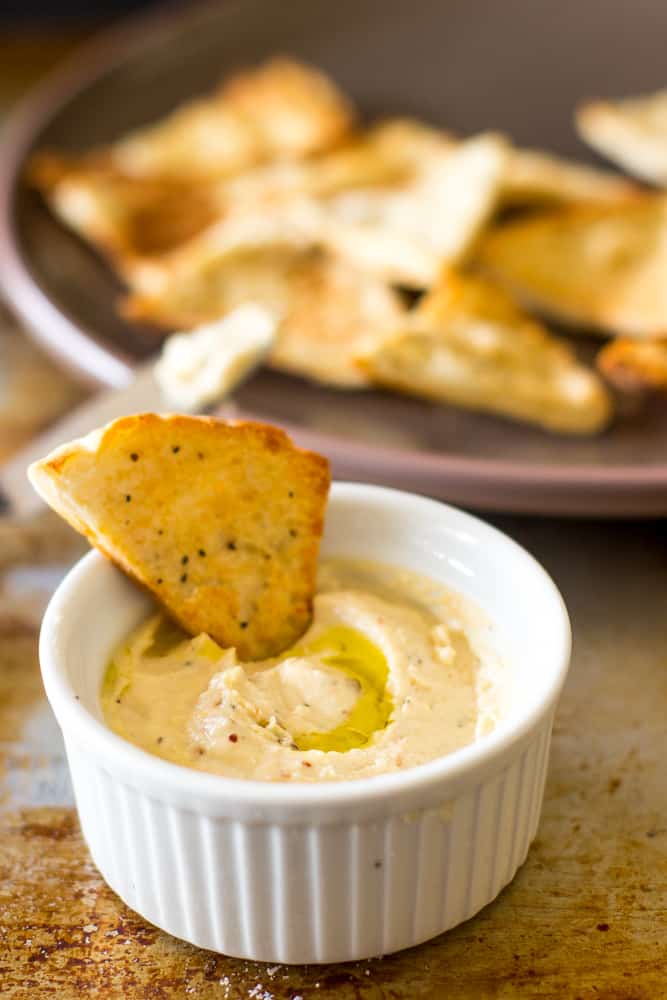 Whipped feta dip with garlic pita chip dipped in it. 
