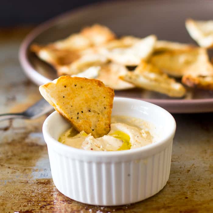 Whipped feta dip with a chip in it. 