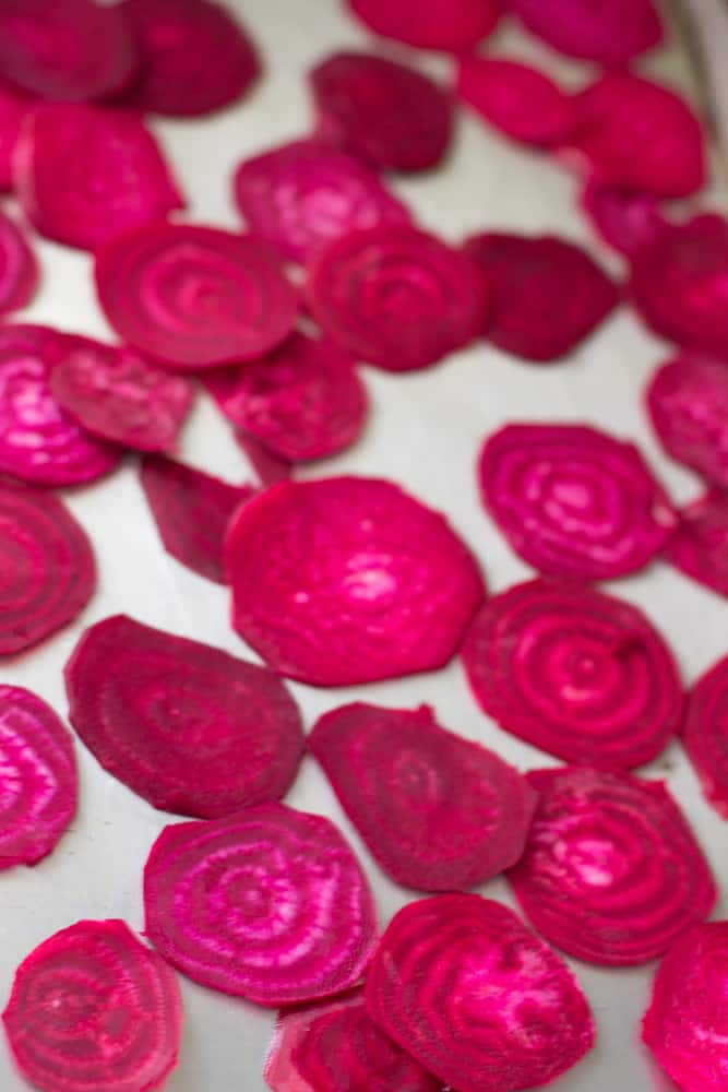 Slices of beet on a baking sheet.