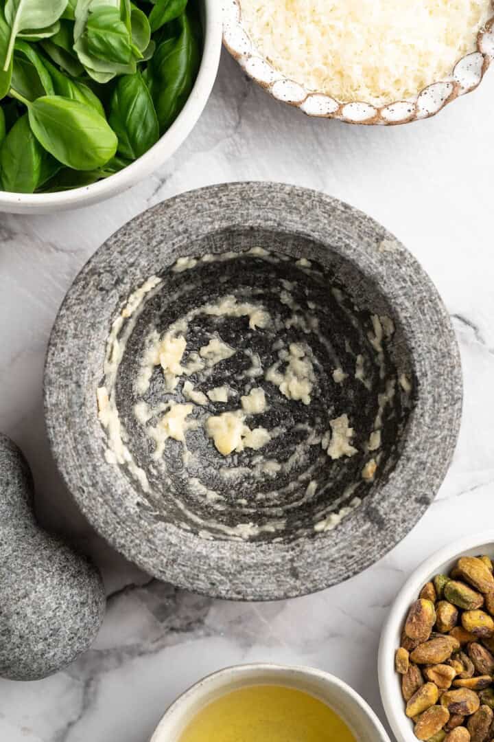 Overhead view of mashed garlic in mortar - 11