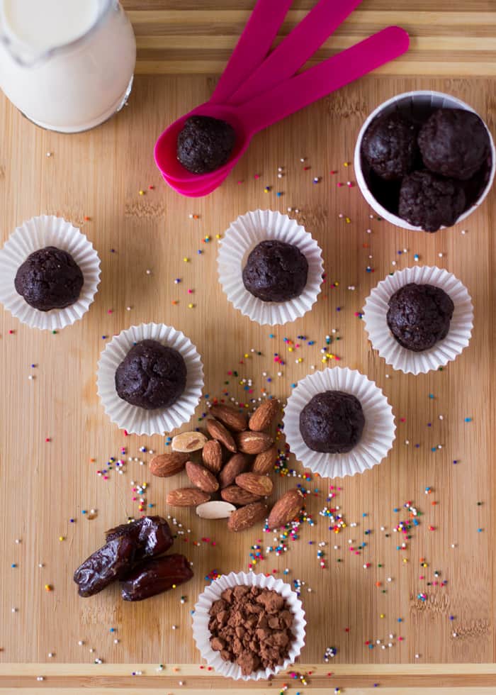Top down shot of brownie bites in paper cups.