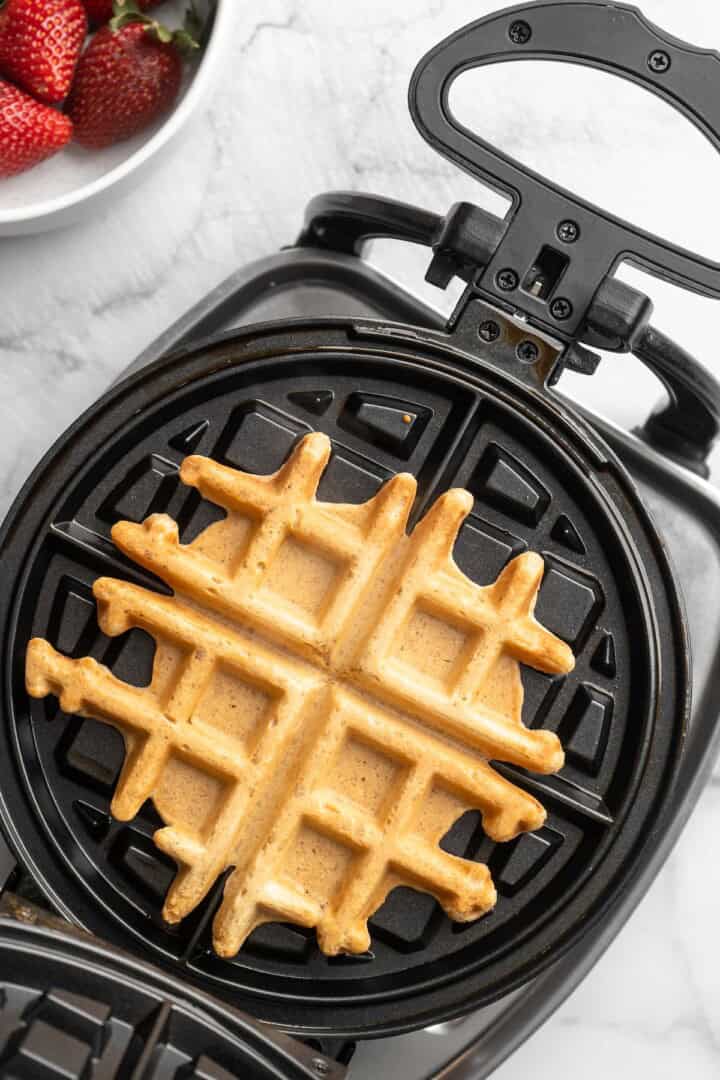 Overhead view of peanut butter waffle in waffle maker