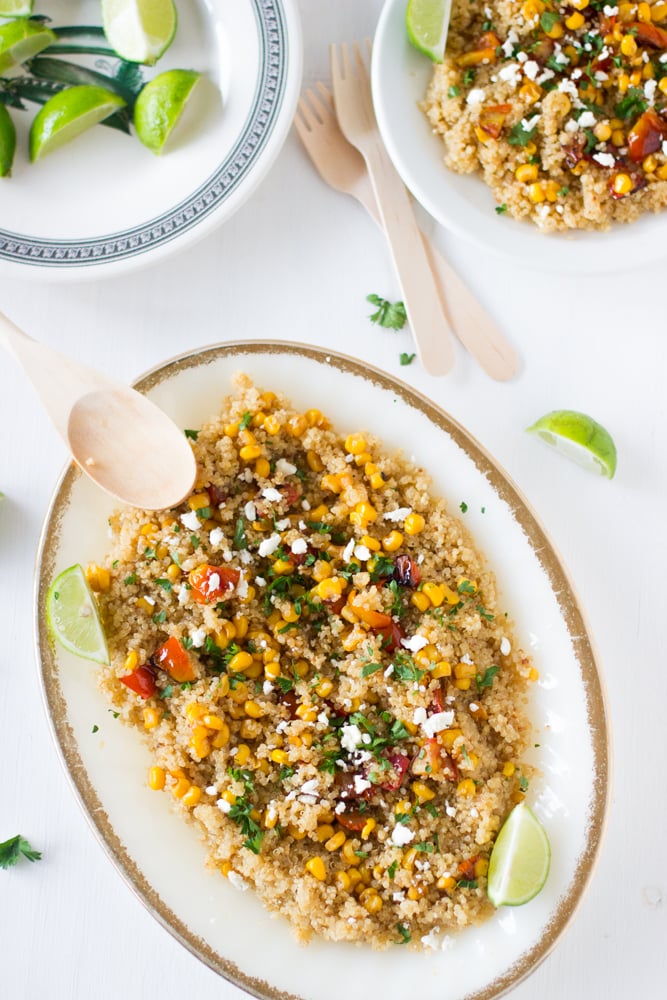 Quinoa and corn salad on a long white plate.