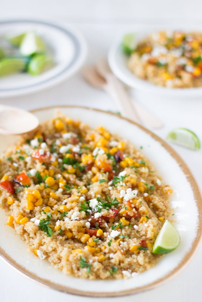 Quinoa and corn salad on a long white plate. 