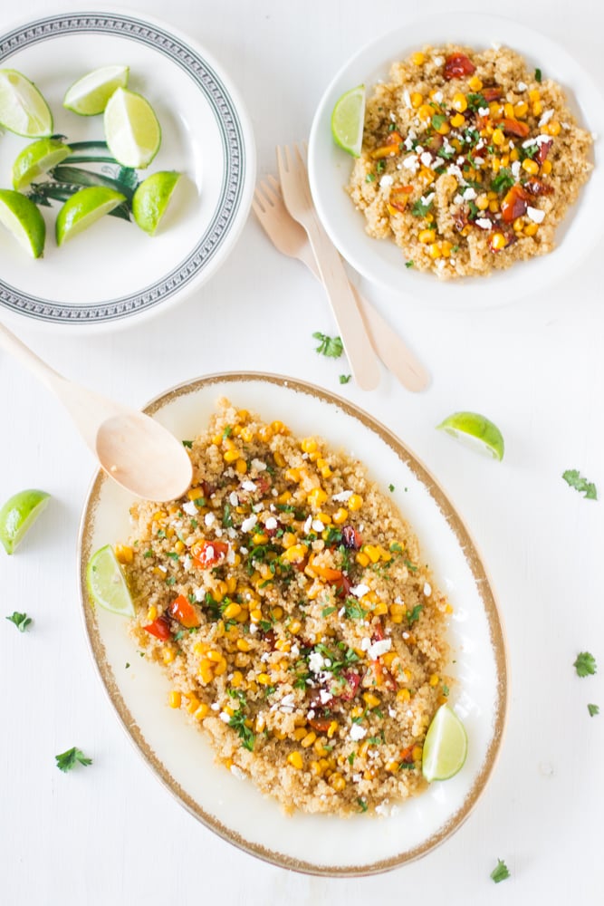 Quinoa and corn salad on a long white dish.