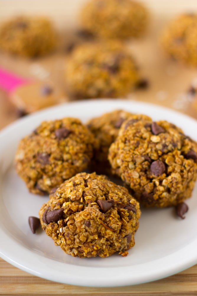 A plate of breakfast cookies with chocolate chips. 