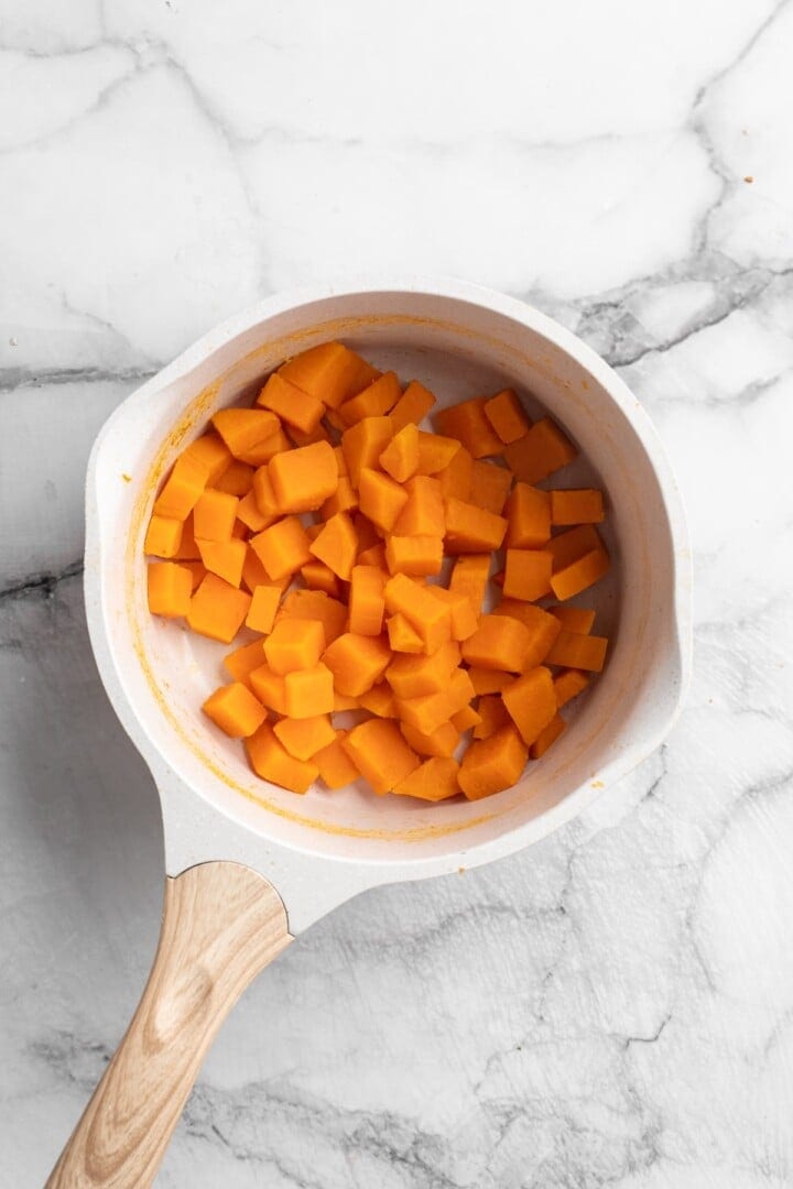 Cooked sweet potato cubes in pan