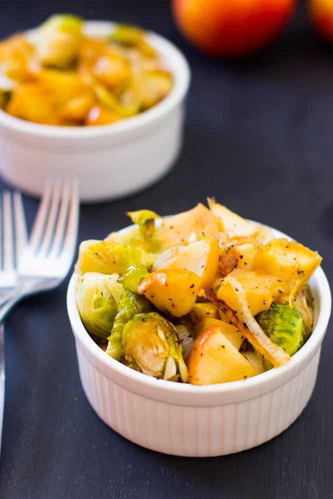 Maple Roasted Brussels Sprouts in a ramekin with forks on the side. 
