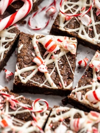 Peppermint brownies topped with white chocolate and candy canes.