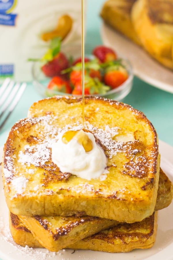 Syrup pouring on french toast. 