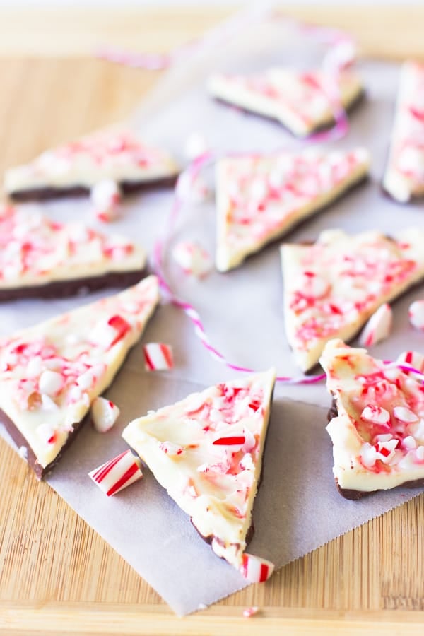 White Chocolate Peppermint Bark pieces on parchment. 