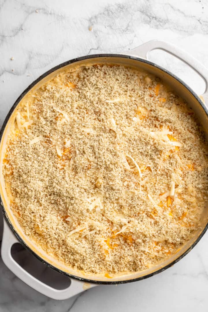 Panko mixture added to skillet of 3 cheese vegan mac and cheese.