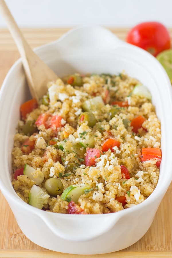 This Mediterranean Quinoa Salad is a quick and easy protein packed quinoa salad loaded with cucumbers, olives, feta cheese and delicious juicy tomatoes! It's all ready in under 30 minutes