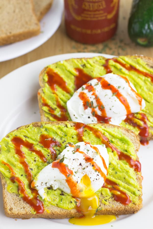 Two poached eggs on toast with avocado.
