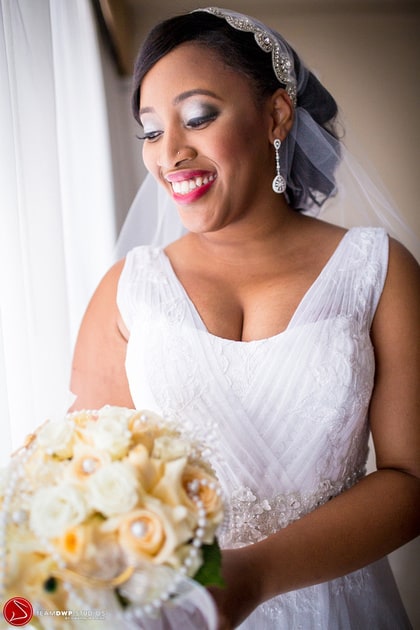 Jessica smiling in her wedding dress.