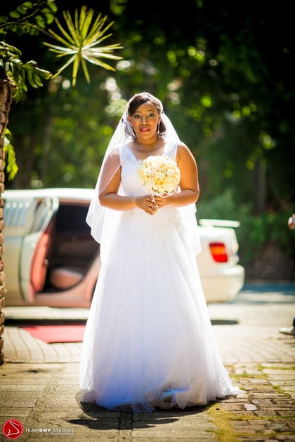 Jessica walking in her wedding dress.