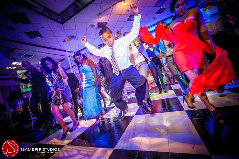 Young boy dancing on the dancefloor. 