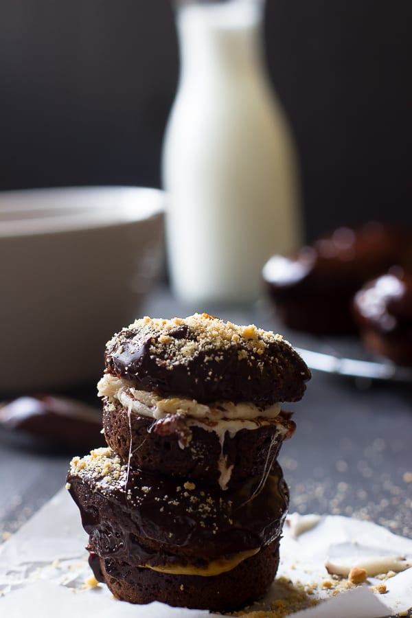 A stack of baked chocolate cake s'mores donuts.