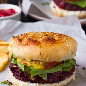 Vegan quinoa beet burgers on parchment paper.