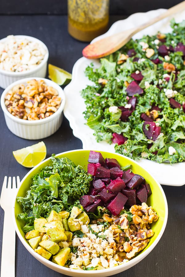 Beet and feta salad in a green bowl.