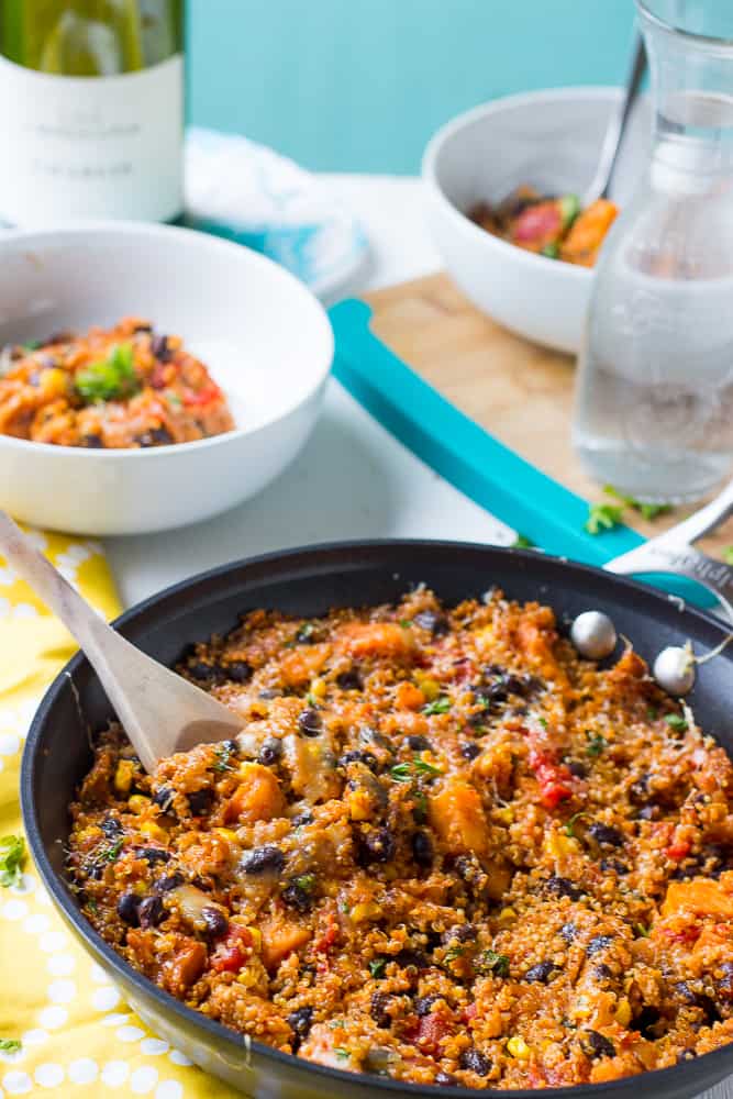 Quinoa enchilada skillet being stirred in a pan.