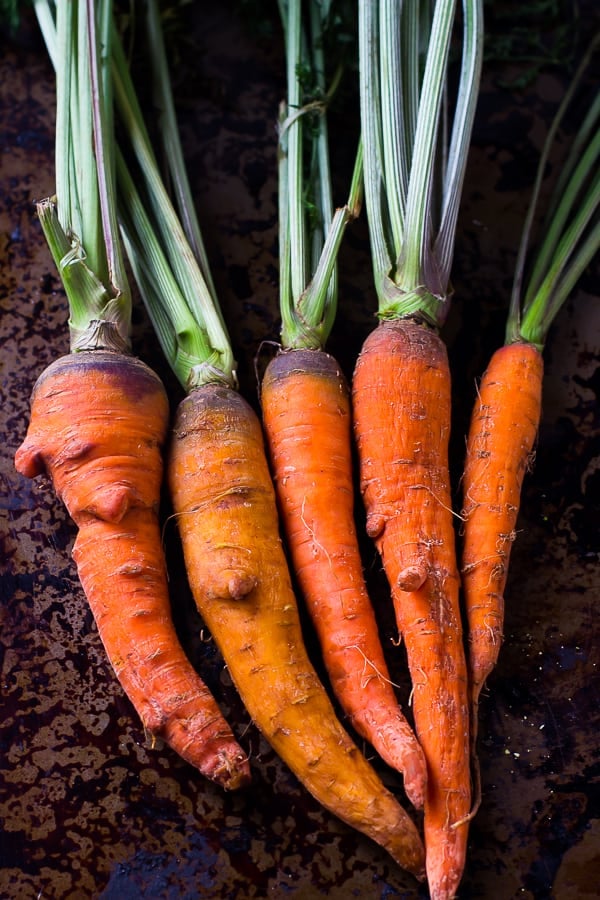 A row of raw carrots.