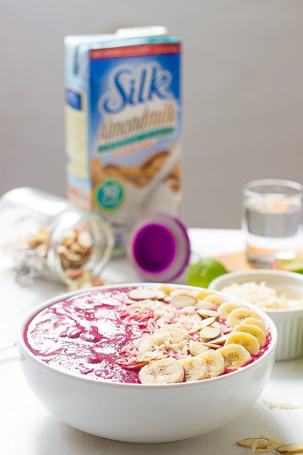 Side shot of a banana berry beet smoothie bowl.