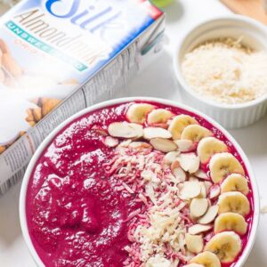 Overhead shot of banana berry beet smoothie bowl.