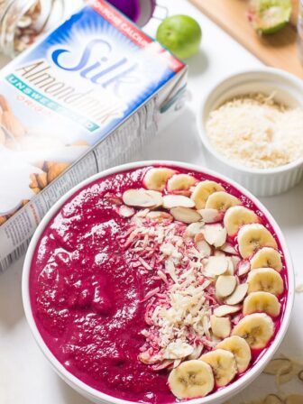 Overhead shot of banana berry beet smoothie bowl.
